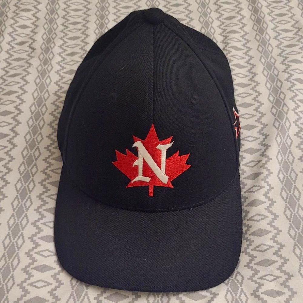 Black ball cap with red Maple Leaf and overlapping white N logo.  SM - MD size.